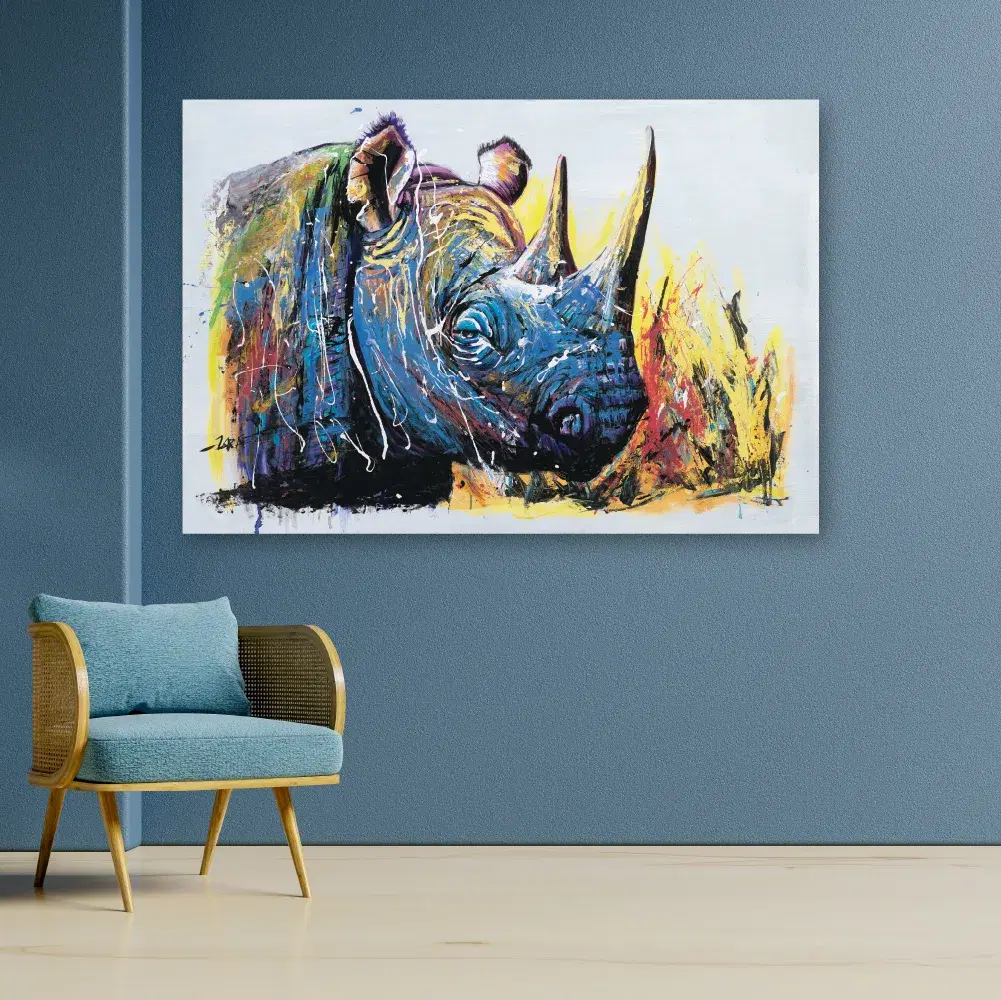 Savanna Horn print in a blue room with a cane armchair
